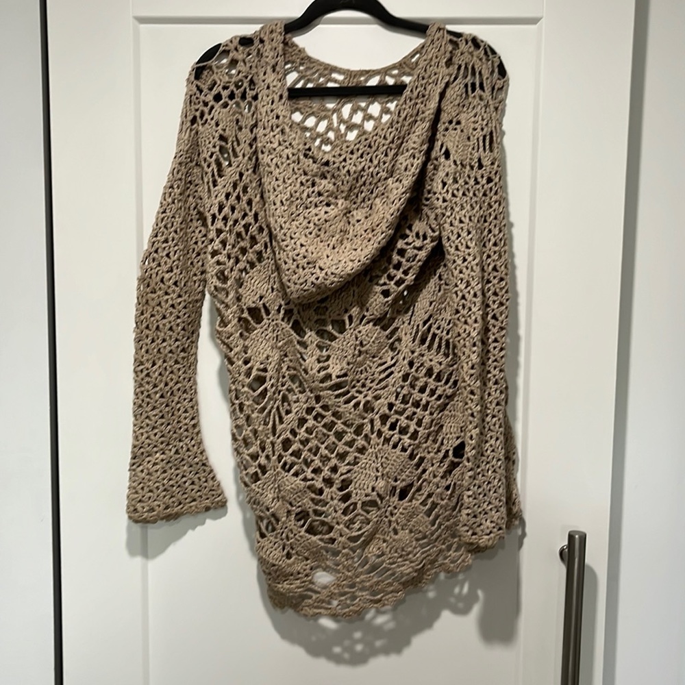 Hooded crochet beach cover up.